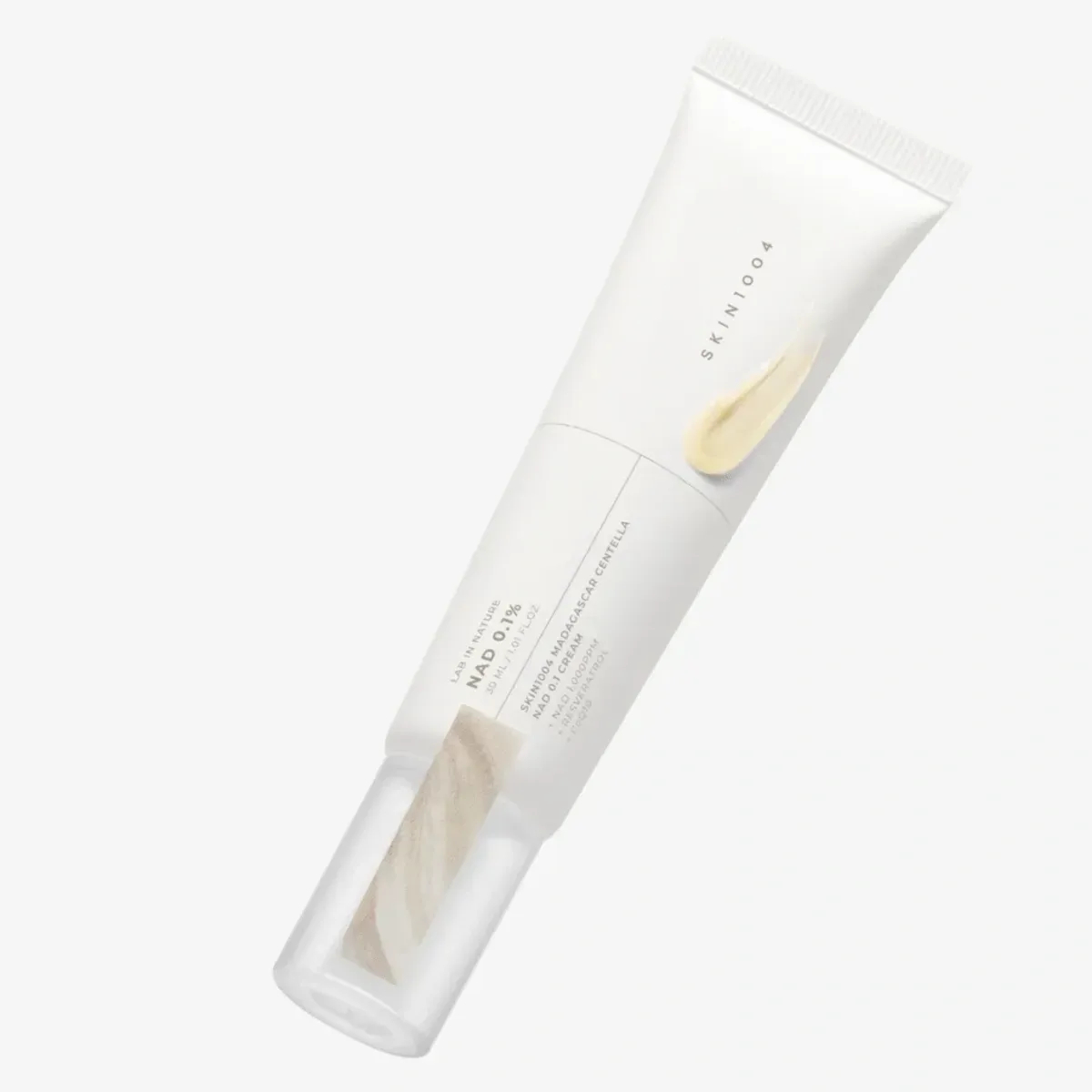 SKIN1004 Madagascar Centella NAD 0.1 Cream — туба з мазком кремово-жовтого крему