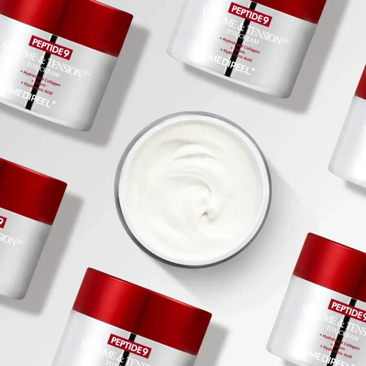 Medi-Peel Peptide 9 Volume & Tension Tox Cream Pro — кілька банок крему з текстурою