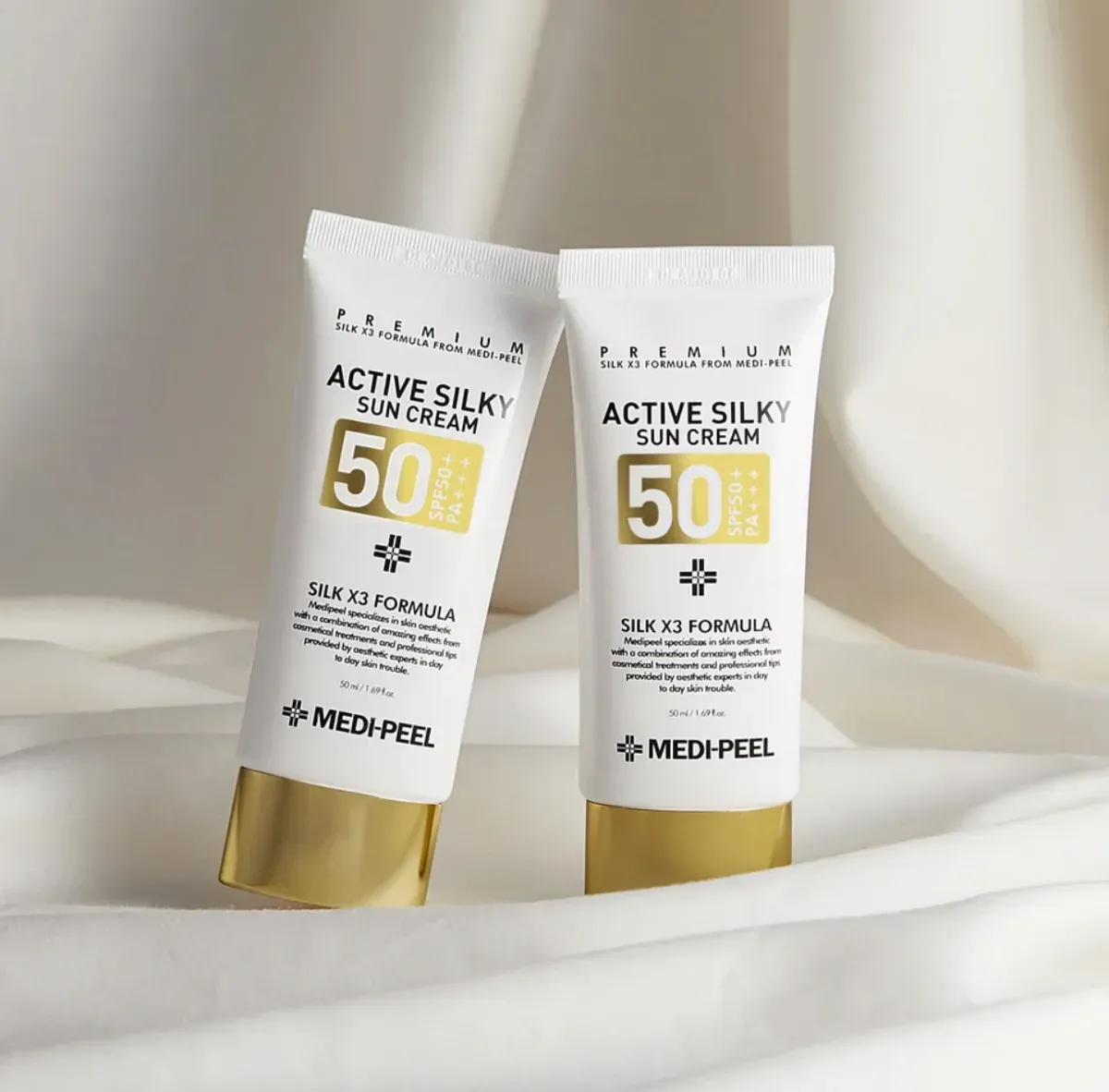 Medi-Peel Active Silky Sun Cream SPF50+ — два тюбики крему на тканині